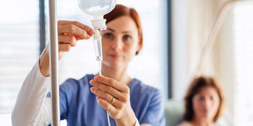A Skin Specialist Giving iv drip of glutathione injection to a patient