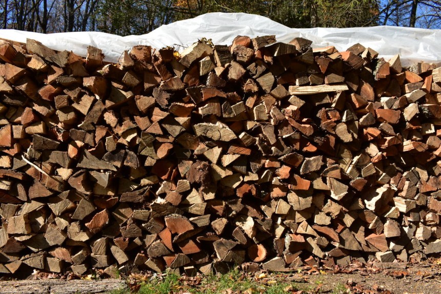 Mixed Hardwood Firewood neatly stacked for sale with full and half cord options