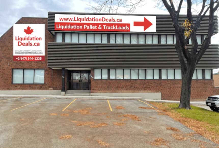Exterior of LiquidationDeals.ca warehouse building with signage advertising liquidation pallets and truckloads and contact details displayed on the front wall