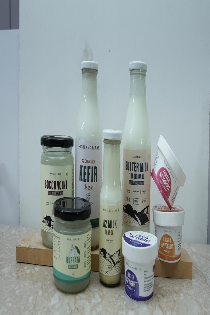 "Highland Farms free-range A2 cow milk products featuring kefir, buttermilk, burrata cheese, bocconcini cheese, thandai, and frozen yogurt."